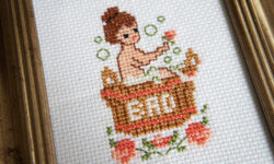 Dame i bad broderi